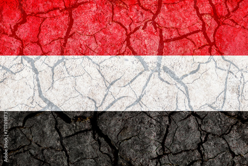Yemen Flag with Cracks of Ground Texture Photo. Yemen Flag Background. photo