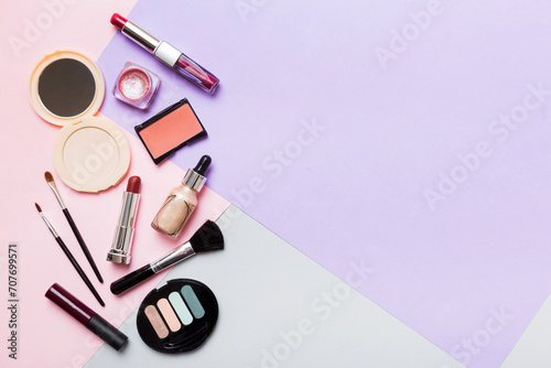 Professional makeup tools. Top view. Flat lay. Beauty, decorative cosmetics. Makeup brushes set and color eyeshadow palette on table background. Minimalistic style photo