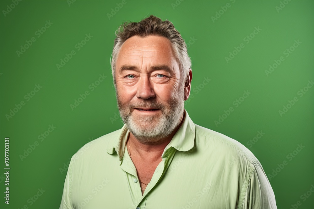 Portrait of a happy senior man with beard on a green background. Portrait of a happy senior man with beard on a green background.