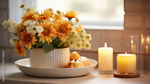 Cozy autumn background with pumpkin, candles and vase with spring summer flowers with copy space in white and orange colours, Valentine day, 8 March, Mother day, 14 February, International Women Day