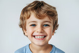 Laughing and smiling Kid boy close up portrait isolated on white background 