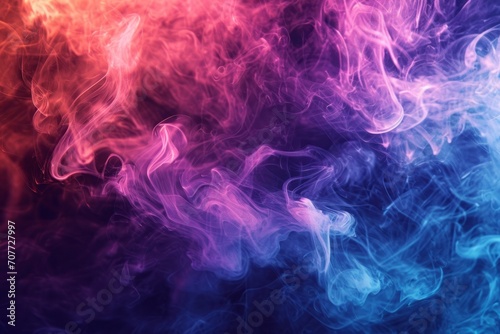 A cloud of smoke fills the frame, with pink and blue colors blending together. The background is a black surface.