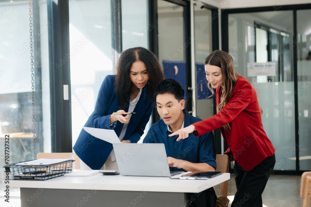 Office colleagues have a casual discussion. During a meeting in a conference room, a group of business teem sit in the conference room Office colleagues have a casual discussion. During a meeting in a conference room, a group of business teem sit in the conference room