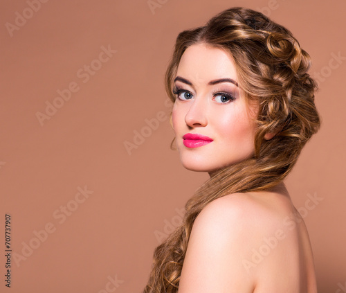 Young beautiful blond woman with long hairdress