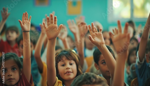 student hand up in the classroom