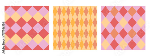 A set of seamless simple diamond patterns in pink, red and yellow colors. Vector graphics.