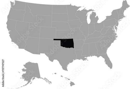 Black Map of US federal state of Oklahoma within gray map of United States of America