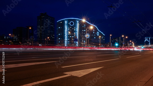 Landscape of the city of Minsk in Belarus blurred lights of car headlamps in the motion of the window lighting in the evening