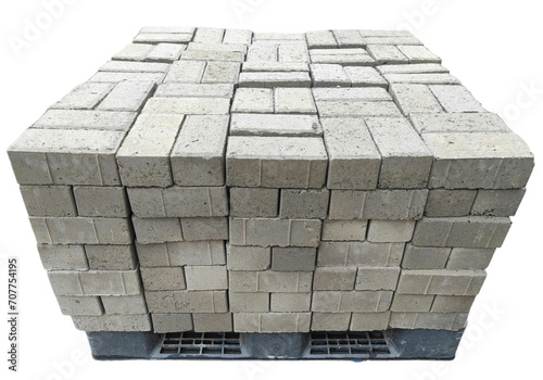 Pile of concrete bricks or paving blocks on pallet isolated on transparent background