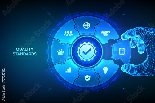 Quality standards control technology concept. ISO standardization certification service concept. Wireframe hand places an element into a composition visualizing quality control. Vector illustration. photo