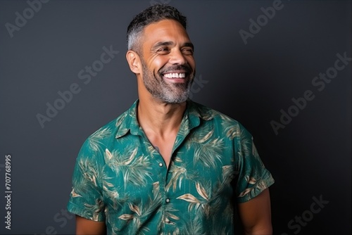 Portrait of a smiling middle-aged man in a green shirt