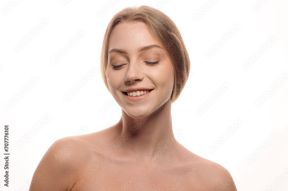 Beautiful beauty portrait of a smiling blonde girl on an isolated white background. Skin care concept Beautiful beauty portrait of a smiling blonde girl on an isolated white background. Skin care concept