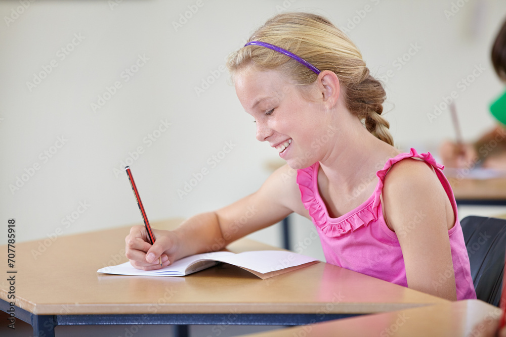 School, girl and smile for writing in classroom, studying lesson or learning assessment at desk. Child, student or happy kid drawing in notebook of academic development, educational test or knowledge School, girl and smile for writing in classroom, studying lesson or learning assessment at desk. Child, student or happy kid drawing in notebook of academic development, educational test or knowledge