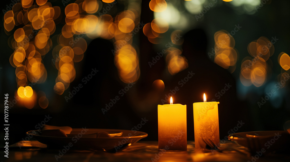 Silhouette photo of a couple doing candle light dinner with bokeh background. Romantic valentine concept