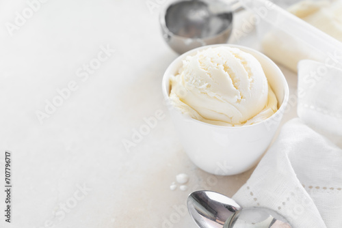 Fototapeta Naklejka Na Ścianę i Meble -  Vanilla ice cream in white cup, marble background