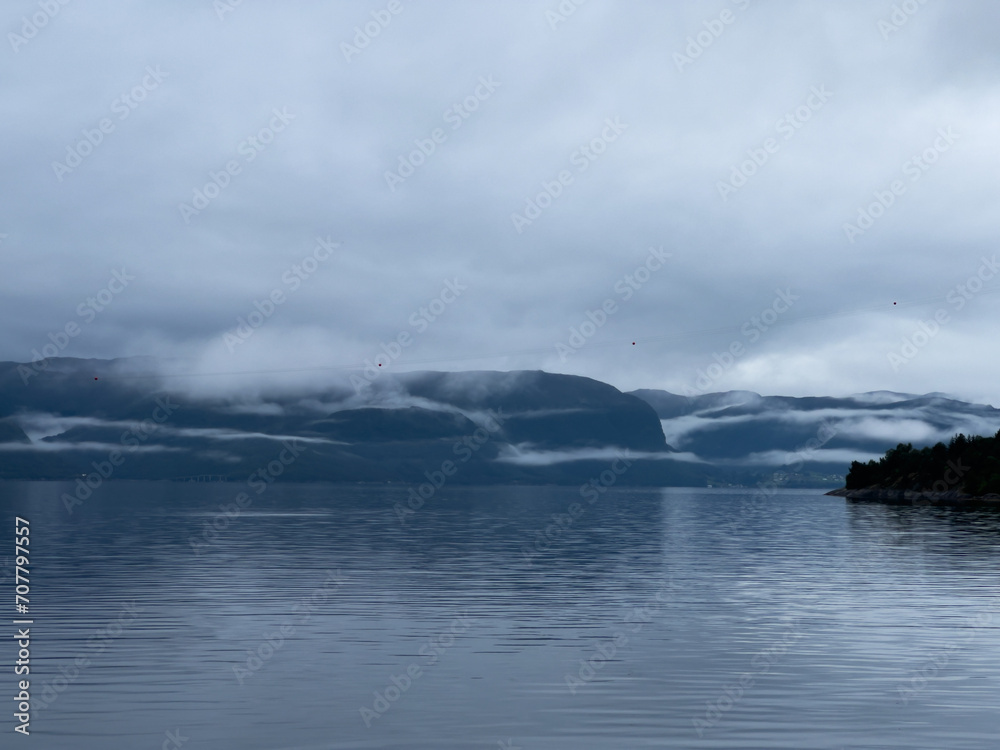 Obraz premium A scene of a ferry on a rainy day crossing the Sogn Fjord, Norway