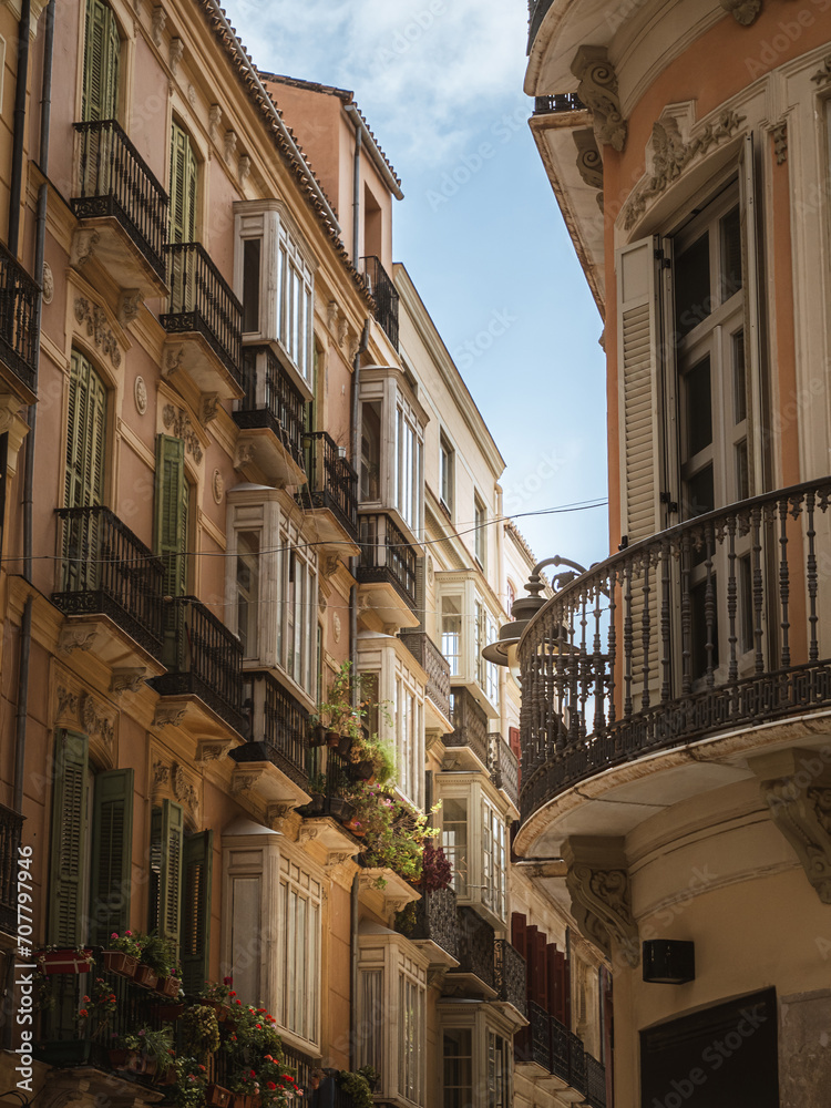 Beautiful facades and balconies of a street in the historical old town of Málaga, Andalusia, Spain