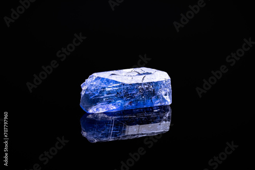 gemmy tanzanite (blue violet zoisite) photography isolated on black background. Tanzania. macro detail close-up rough raw unpolished semi-precious gemstone.
