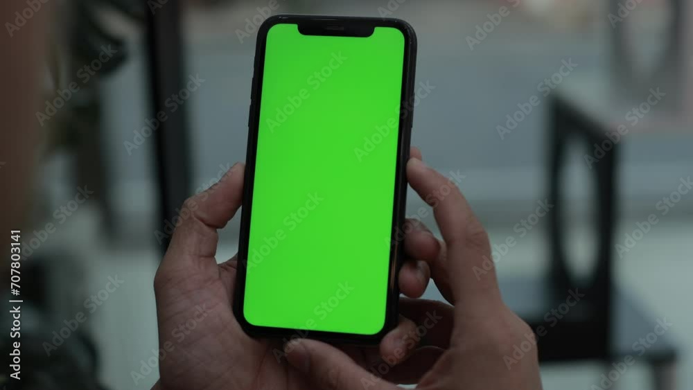Phone in hand, smartphone green screen, hand holding mobile phone 