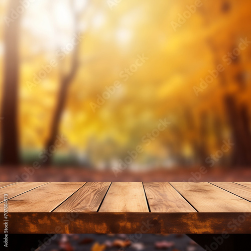 Empty natural wooden table for displaying products with blurred background of autumn forest. background of autumn scenery Collection of autumn nature and product advertising