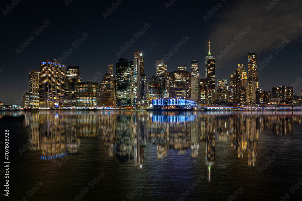 view of the New York skyline at night with reflections, skyline cities. New York.