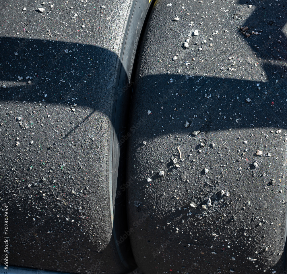 Φωτογραφία Detail of the texture of the slick tires dirty with pebbles from the circuit