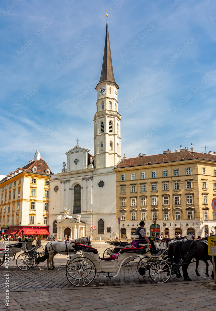 Horse carriages on St. Michael square (Michaelerplatz), Vienna, Austria