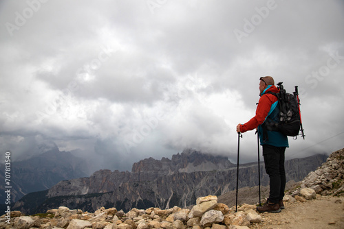 Man traveler traveling alone in breathtaking landscape of Dolomites Mounatains. Travel lifestyle wanderlust adventure concept. © erika8213