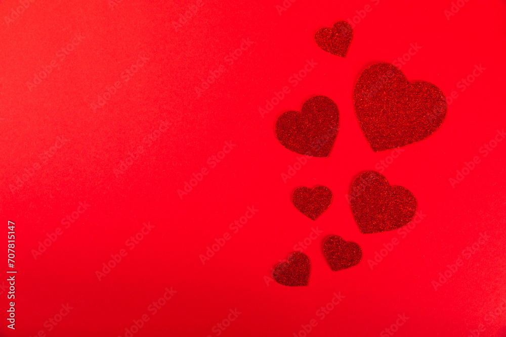 Valentine's Day concept. Valentine's Day background. Gifts, candles, confetti, envelope - postcard on a red background. Flatley, top view, copy space.Valentine's day celebration
