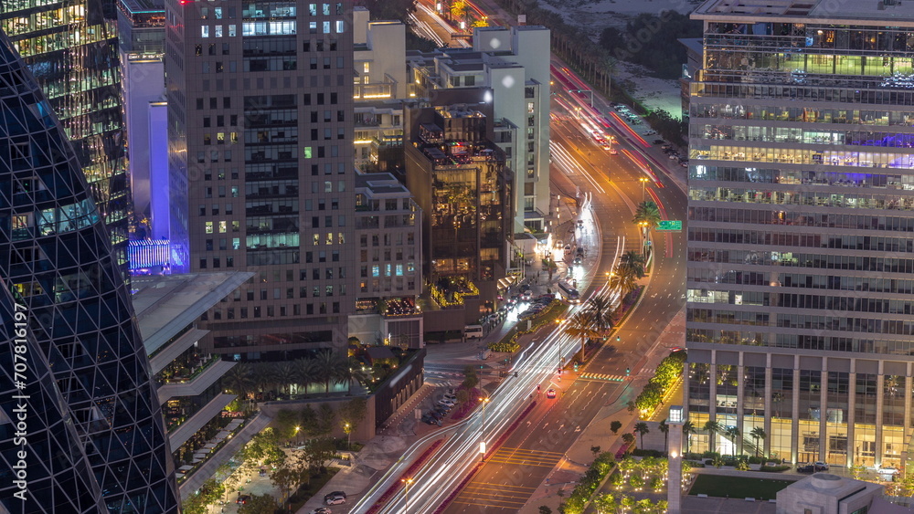 Aerial view of traffic on Al Saada street in financial district day to night timelapse in Dubai, UAE. Aerial view of traffic on Al Saada street in financial district day to night timelapse in Dubai, UAE.