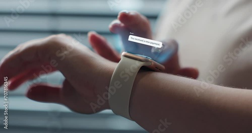 Close up of woman hands checking 3d rendering incoming notification on smart watch. Incoming text message received on smart watch. Social media networking technology concept. photo