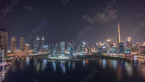 Aerial view to Dubai Business Bay and Downtown with the various skyscrapers and towers night timelapse © neiezhmakov
