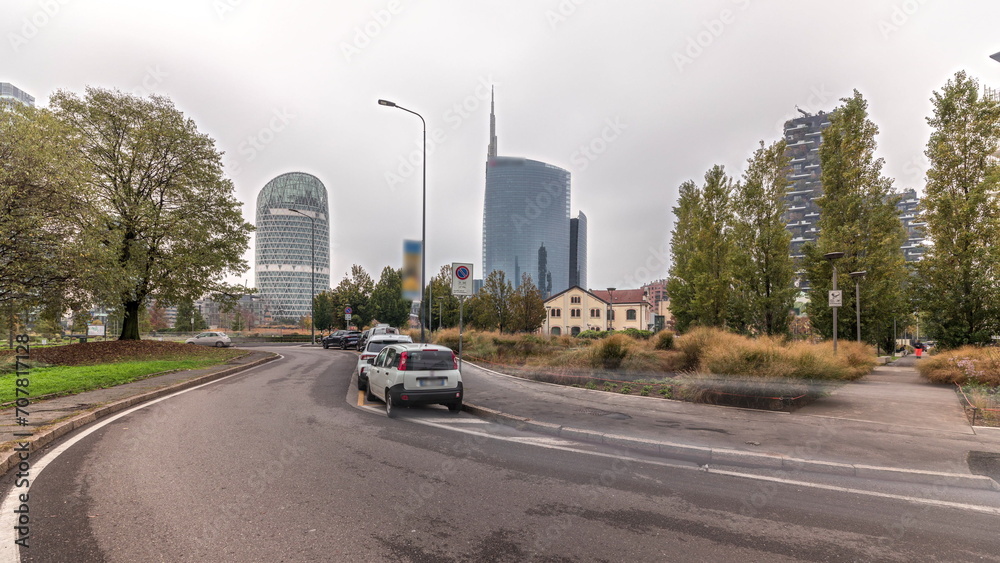 Panorama showing skyscrapers and towers from park with green lawn timelapse in Milan