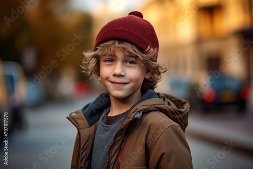 Portrait of a cute boy on the street. Selective focus.