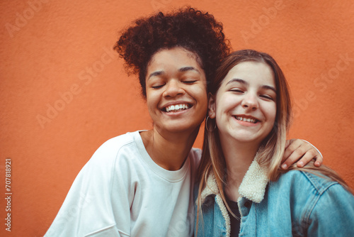 Wallpaper Mural Portrait of two happy joyful teen girls of different races making selfie, enjoying friendship. Torontodigital.ca