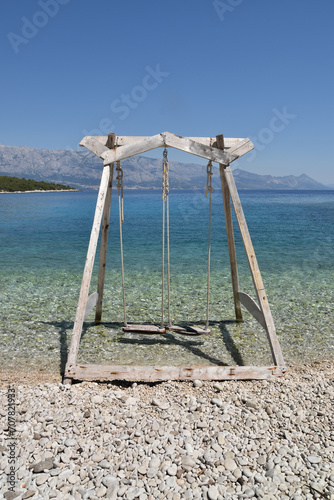 Wooden Swing On The Beach