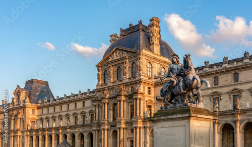 Louis XIV statue in Louvre palace courtyard, Paris, France photo