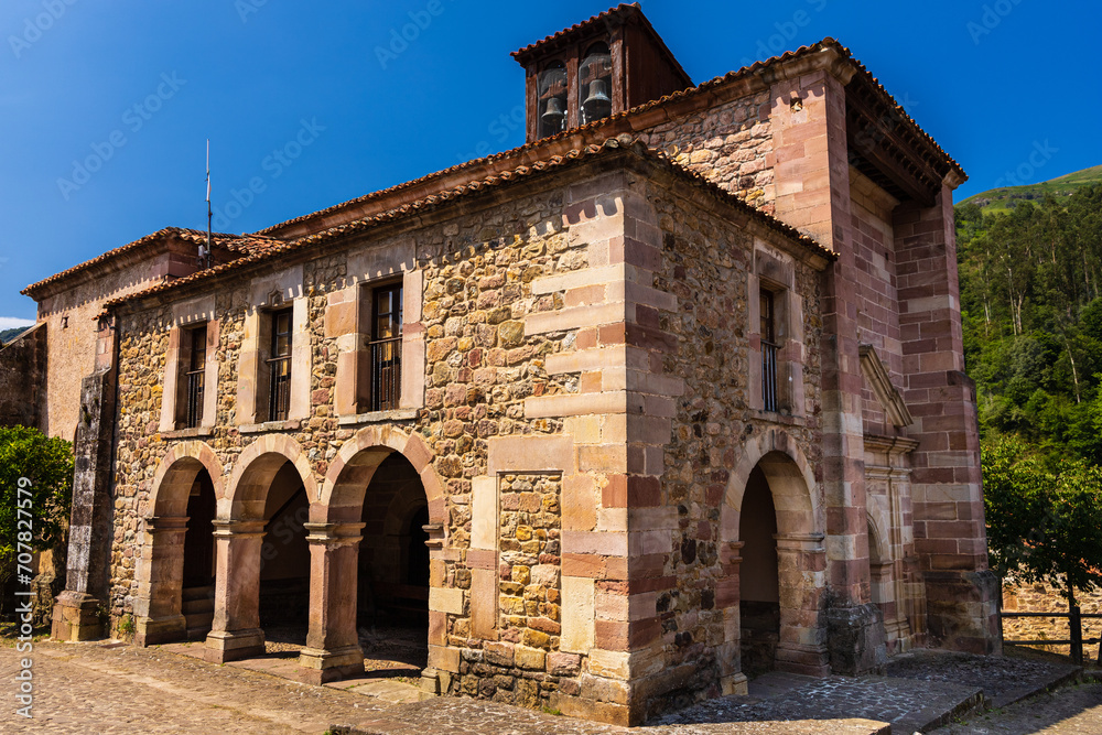 Facade of old stone Church of San Roque. Carmona, Cantabria, Spain.