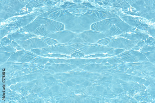 Bluewater waves on the surface ripples blurred. Defocus blurred transparent blue colored clear calm water surface texture with splash and bubbles. Water waves with shining pattern texture background.