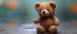 Teddy bear in the rain.Teddy Bear with sitting in the raining and vintage filter effect blurred background of nature.