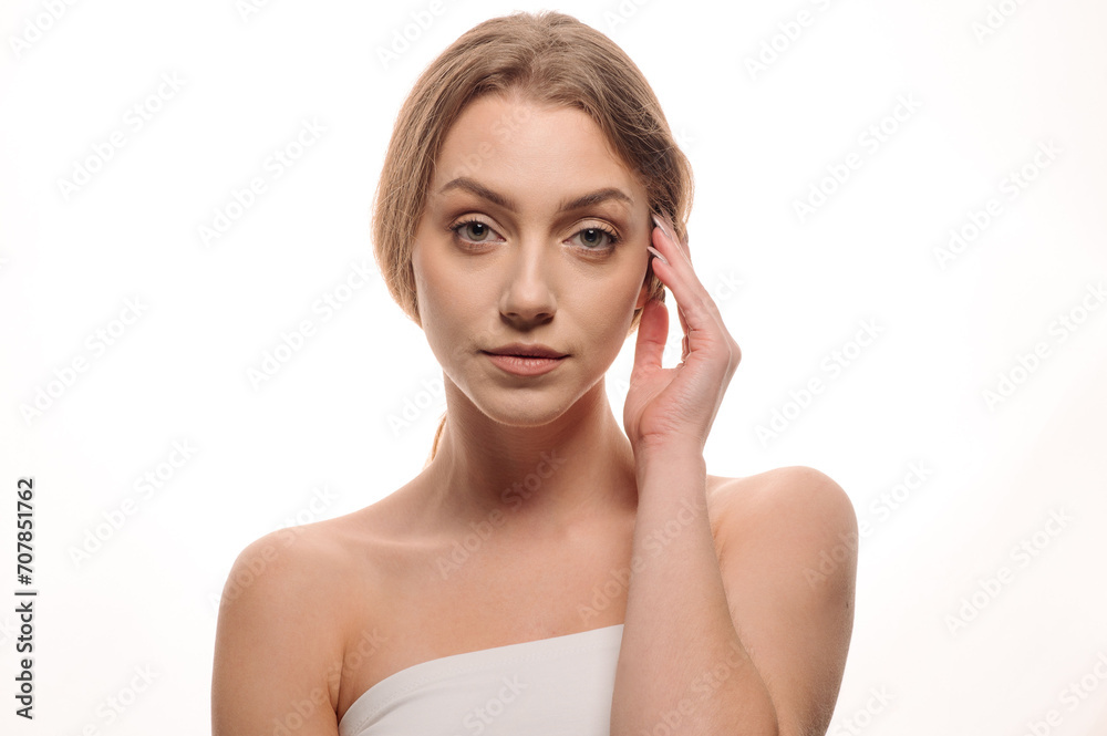 Beauty portrait of a beautiful girl on an isolated white background. Skin care concept. Cosmetology Beauty portrait of a beautiful girl on an isolated white background. Skin care concept. Cosmetology