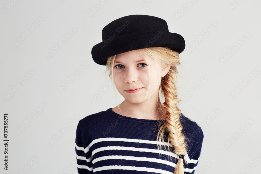 Fashion, happy and portrait of child in a studio with casual, cool and stylish outfit and hat. Smile, youth and young girl kid with positive, good and confident attitude for style by white background Fashion, happy and portrait of child in a studio with casual, cool and stylish outfit and hat. Smile, youth and young girl kid with positive, good and confident attitude for style by white background