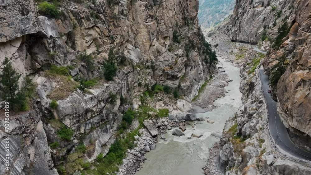 Aerial 4K video of drone moving forward in a deep gorge valley in the mountains Aerial 4K video of drone moving forward in a deep gorge valley in the mountains