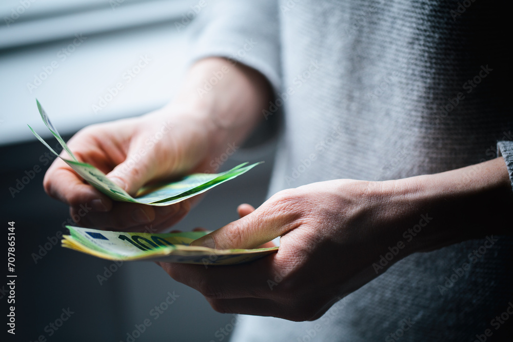 Woman counting Euro bills. Personal or business finance concept. - obrazy, fototapety, plakaty 