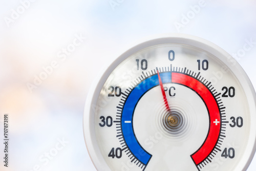 Outdoor thermometer indicates sub-zero temperature