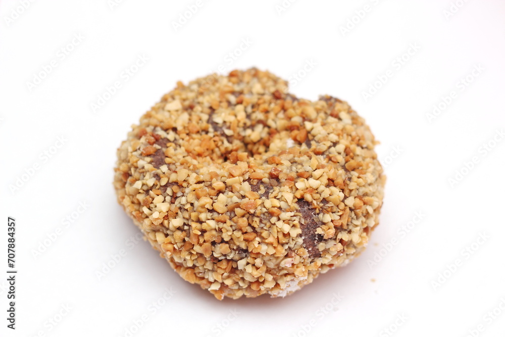 Close up of a chocolate donut isolated on a white background. Close up of a chocolate donut isolated on a white background.