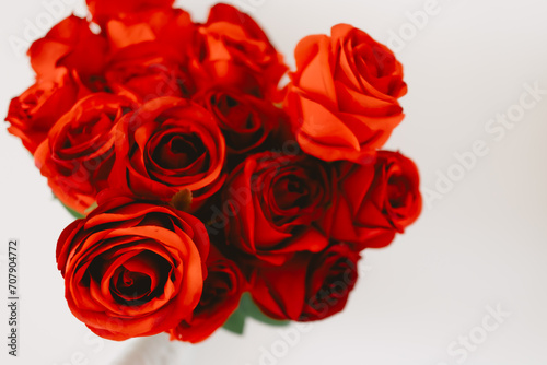 Image of beautiful red roses  flowers isolated over white background wall.