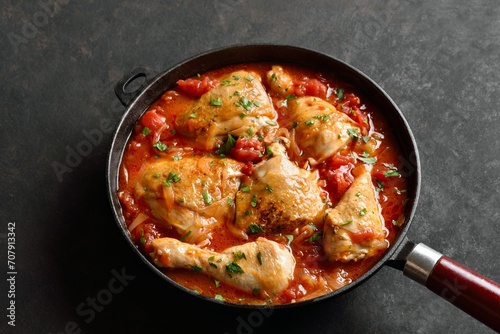 Georgian chicken stew with tomatoes and herbs photo