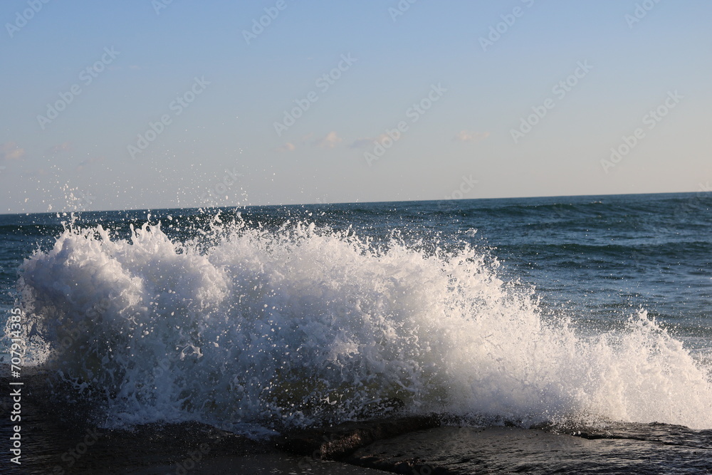 white-crested waves splashing in the water