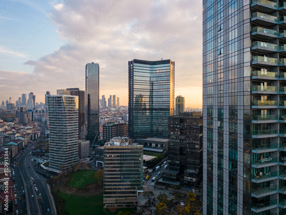 Obraz premium Istanbul's glass and concrete skyscrapers, home to offices, hotels, and residential complexes. Aerial drone view